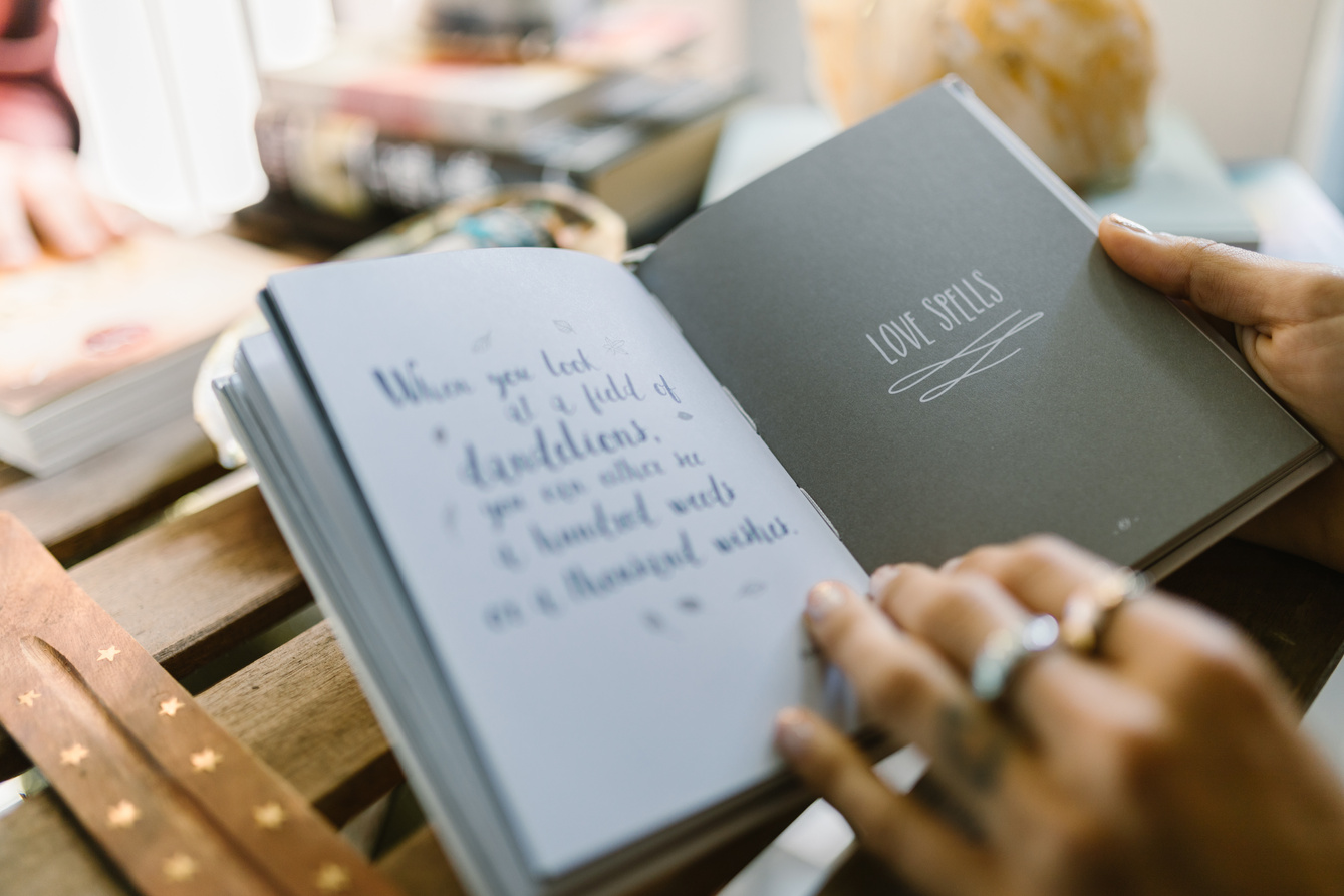 A Hand Flipping the Pages of the Book