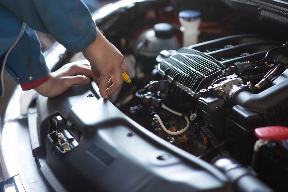 Car mechanic working in auto repair service